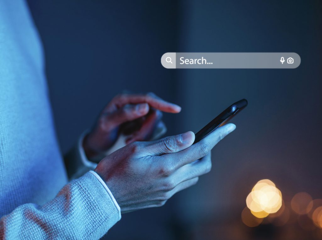 Man who is Googling and using SEO marketing on his phone.